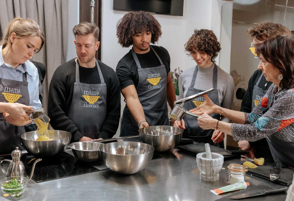 group of students collaborating at a cooking class