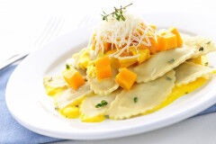tagAlt.Sea Bass filled Ravioli with Pumpkin Sauce Crispy Leeks