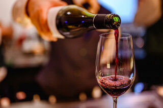 tagAlt.Red wine pouring into glass Cover